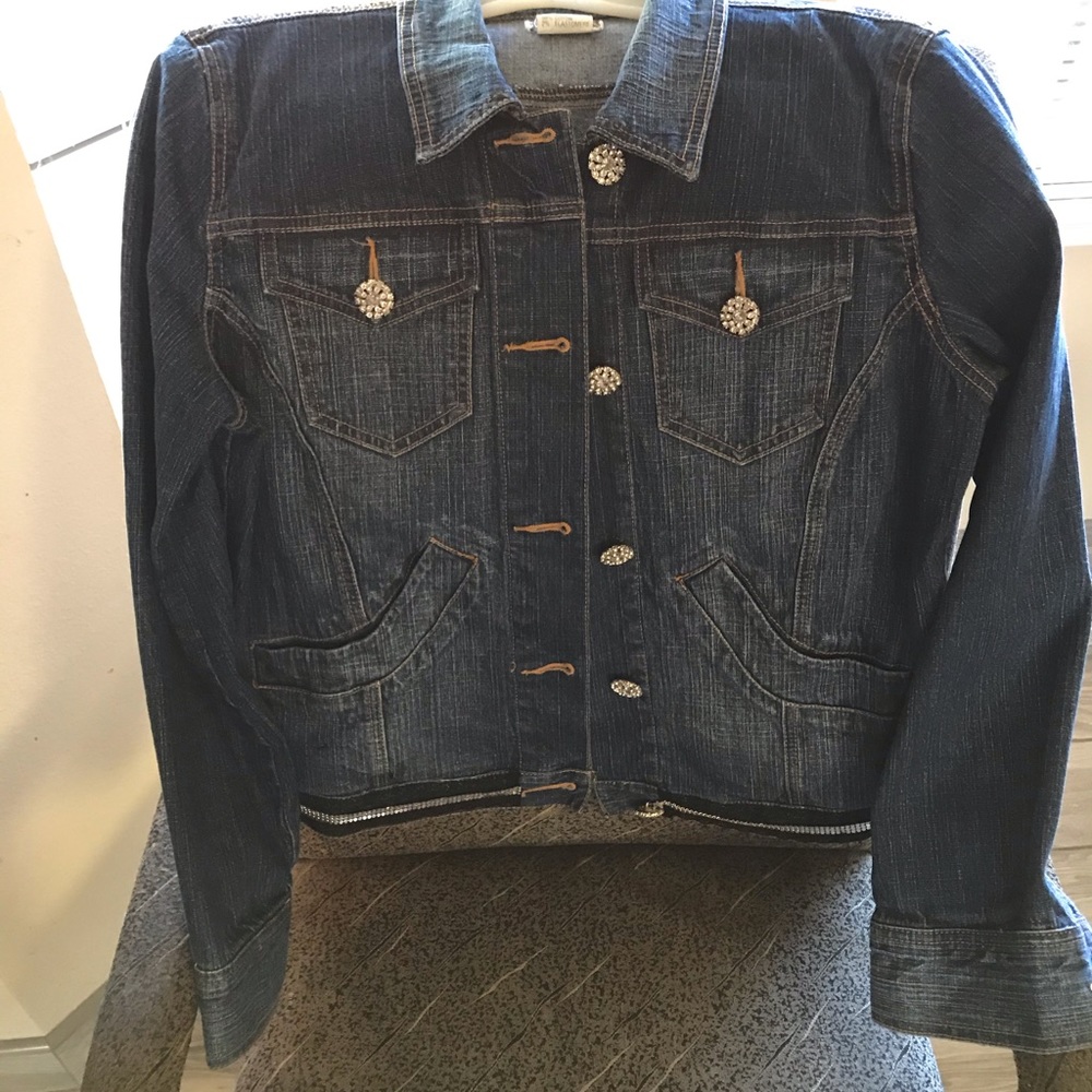 So snazzy Rhinestone buttons adorn this denim jack